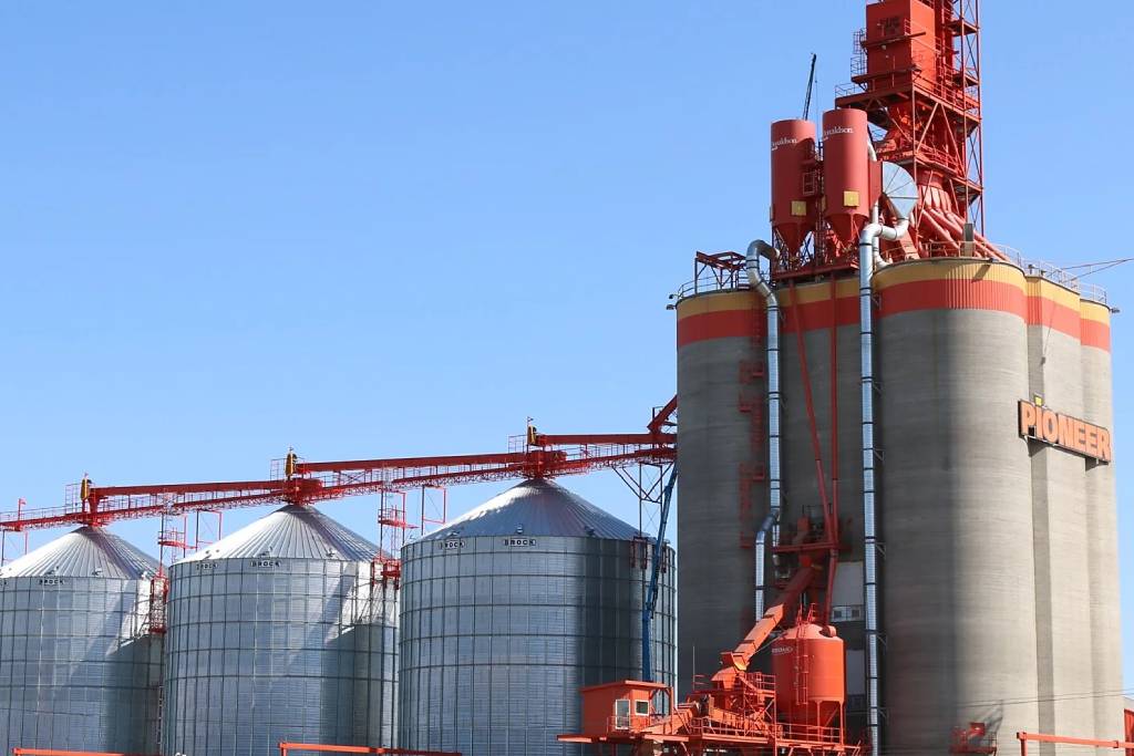 The Richardson Pioneer grain storage system, including an orange grain elevator and three silos.