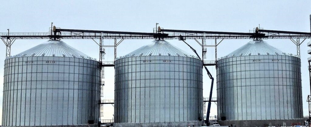 Three large grain silos.